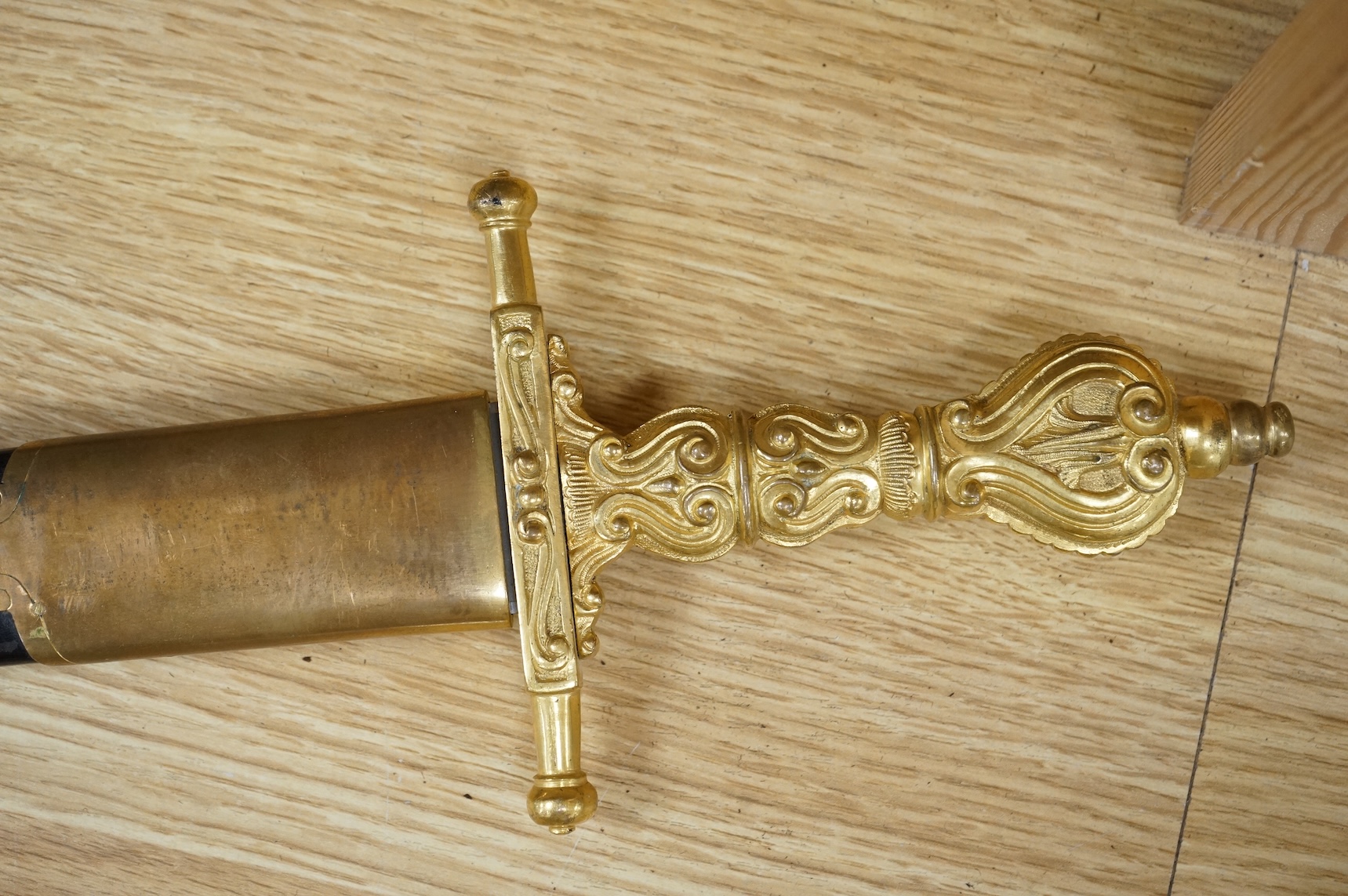 A Scottish sidearm for the King’s Own Bodyguard for Scotland, straight blade by J. Stewart and Son, etched and polished regulation blade, ormolu hilt, in its leather scabbard with ormolu mounts (gilding worn to mounts)
